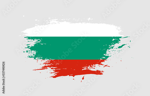 Grunge brush stroke with the national flag of Bulgaria on a white isolated background