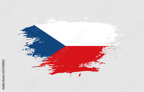 Grunge brush stroke with the national flag of Czechia on a white isolated background