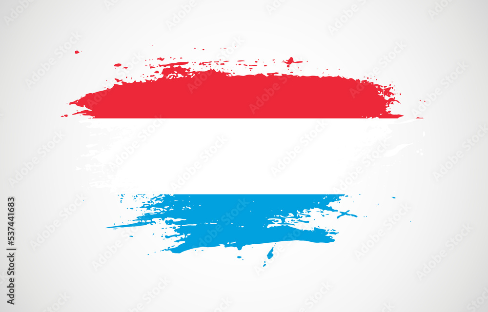 Grunge brush stroke with the national flag of Luxembourg on a white isolated background