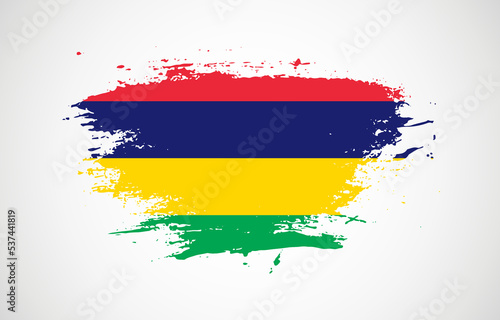 Grunge brush stroke with the national flag of Mauritius on a white isolated background