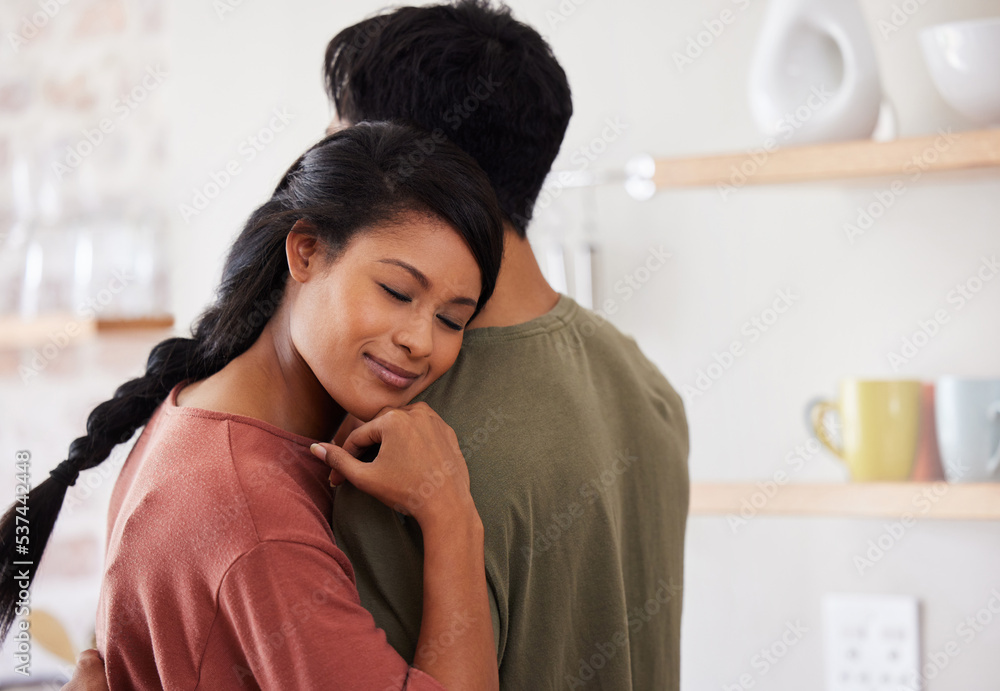 Hug, support and couple with love in their marriage in the kitchen together in their house. Young, happy and relax man and woman hugging for comfort, affection and happiness in their home with smile Hug, support and couple with love in their marriage in the kitchen together in their house. Young, happy and relax man and woman hugging for comfort, affection and happiness in their home with smile