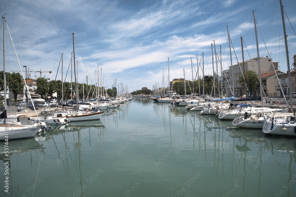 Boats moored along Rimini canal port