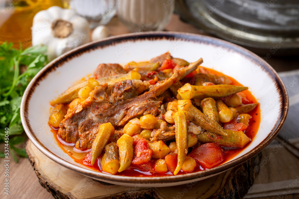 Traditional delicious Turkish cuisine. Locally cooked okra dish. Turkey Adana style meat okra dish. Turkish name; etli bamya yemegi. Traditional delicious Turkish cuisine. Locally cooked okra dish. Turkey Adana style meat okra dish. Turkish name; etli bamya yemegi.
