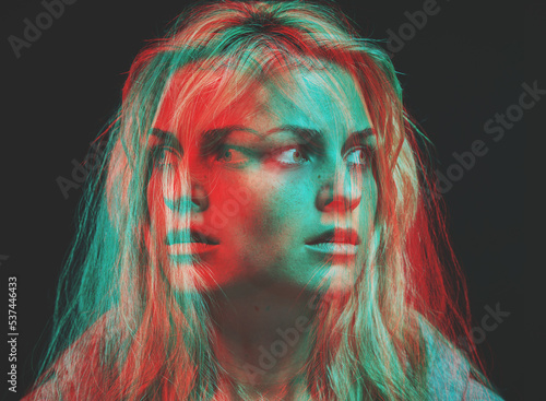 Psychology, bipolar and motion blur psychedelic of woman with mental health fear, insomnia and anxiety on dark background. Overlay of split emotions, schizophrenia and surreal horror of crazy face photo