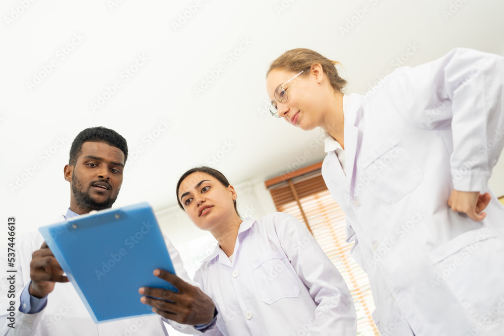 Scientists are taking notes. Happy teams of scientists experiment and research. international group of scientists. scientist teamwork. Scientists are taking notes. Happy teams of scientists experiment and research. international group of scientists. scientist teamwork.