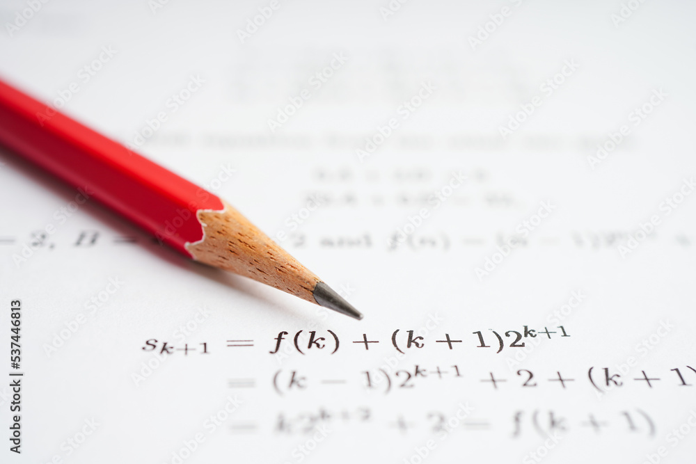 Pencil on mathematic formula exercise test paper in education school. Pencil on mathematic formula exercise test paper in education school.