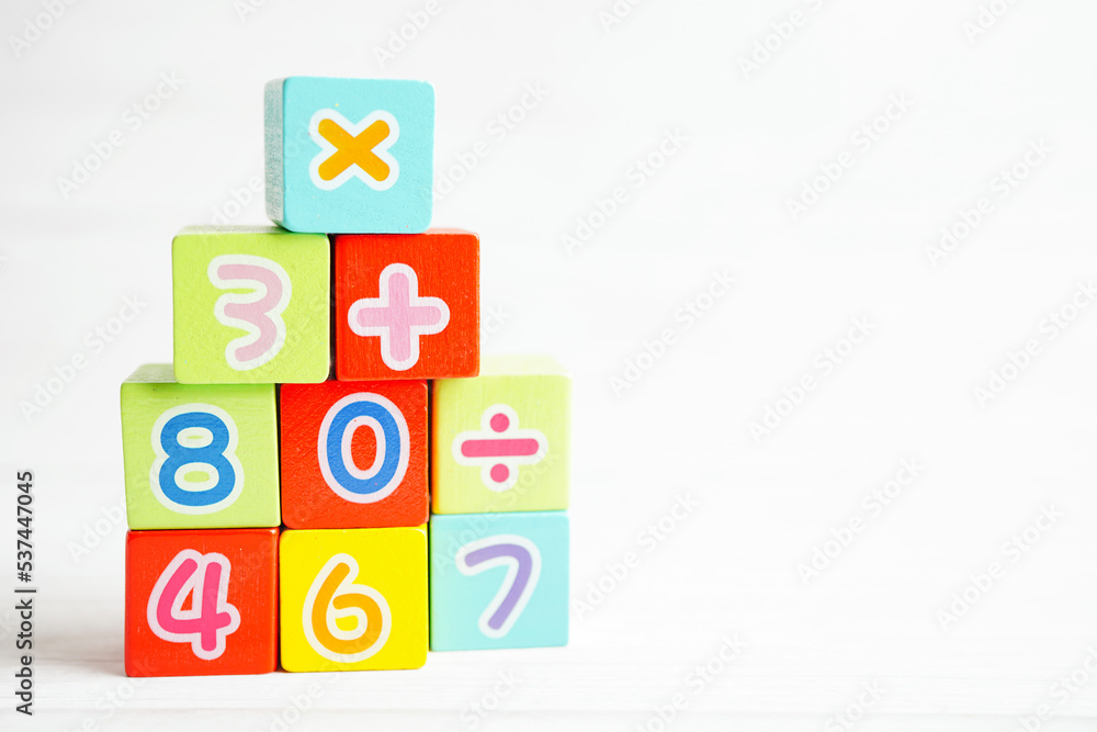 Number wood block cubes for learning Mathematic, education math concept.