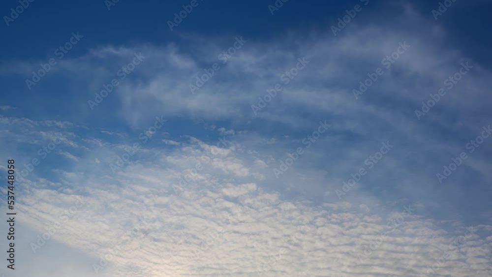 4K timelapse of beautiful blue sky with clouds background, Blue sky with clouds and sun. cloud time lapse nature background. winter sky

