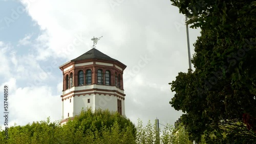 Schlossturm Düsseldorf, Germany. Framed by green trees and cloudy sky