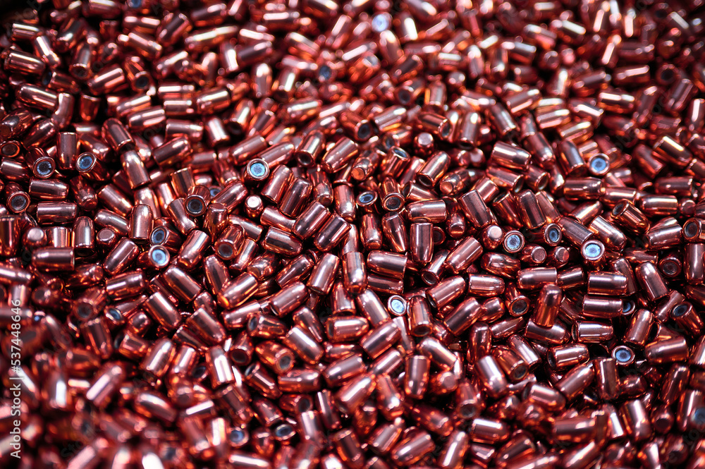 Brass metal bullets pile for weapons as background Brass metal bullets pile for weapons as background