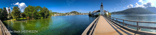 photo background panoramic view of the castle on the island in the middle of the Traunsee lake, Gmunden, Austria, Europe