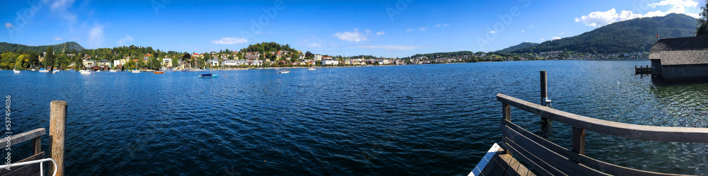 photo background, panoramic view of the lake, wooden jetty without people, and mountains, in the Alps in Austria, Europe photo background, panoramic view of the lake, wooden jetty without people, and mountains, in the Alps in Austria, Europe