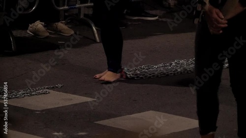 Good Friday procession celebrations in Madrid, Spain, during Holy week. Devotees drag chains on their ancles walking on bear feet as a representation of repentance.