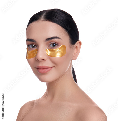 Photo Beautiful young woman with under eye patches on white background