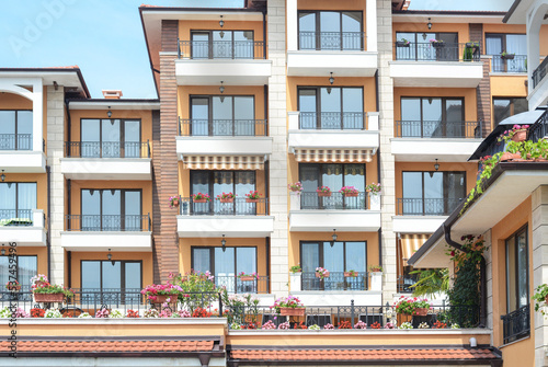 Canvas Print Exterior of residential building with balconies on sunny day