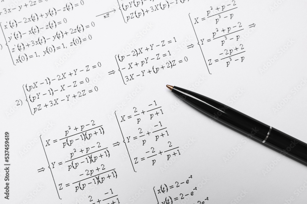Sheet of paper with mathematical formulas and pen, top view Sheet of paper with mathematical formulas and pen, top view