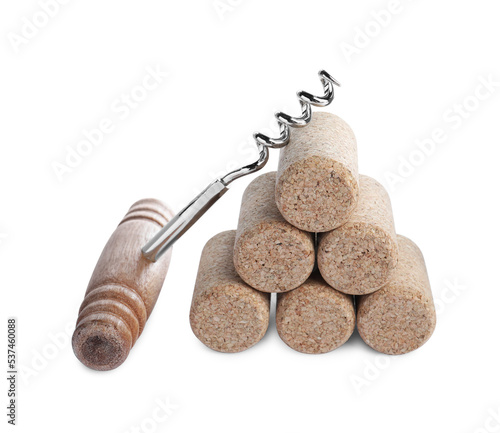 Corkscrew and stacked wine corks on isolated background