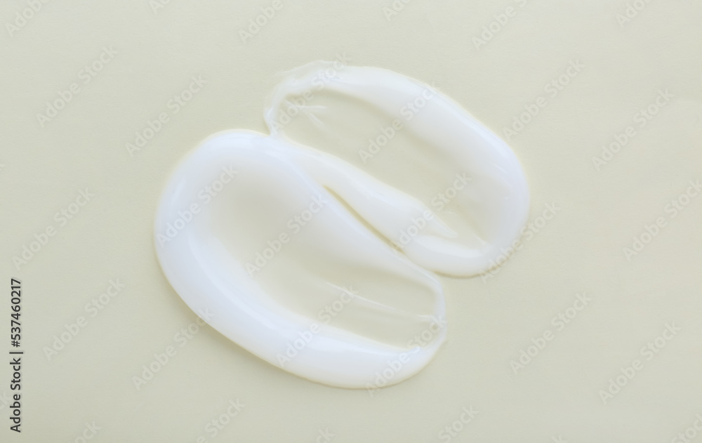Sample of body cream on light background, top view Sample of body cream on light background, top view