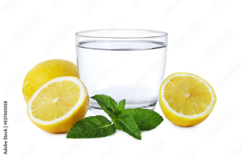 Glass with water, sliced lemon and mint on white background Glass with water, sliced lemon and mint on white background