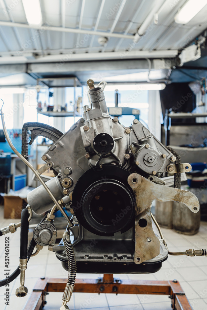 Overhaul of the motor for the car. Parts of an internal combustion engine. Cylinder block with pistons and valves. Overhaul of the motor for the car. Parts of an internal combustion engine. Cylinder block with pistons and valves.