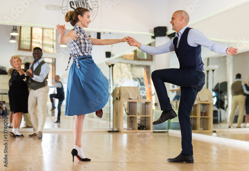 Pair dancing lindy hop during rehearsal