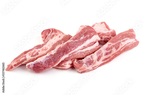 Pork fillet tenderloin with lettuce, raw meat, close-up, isolated on white background.