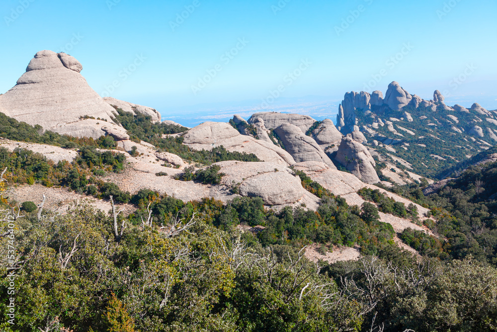 Fototapeta premium Clusters of towering rock in a mountain landscape . Natural park of Montserrat Catalonia Spain