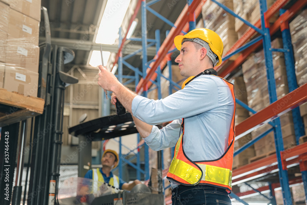 Smart caucasian warehouse man,manager use digital tablet check package with worker forklift driver loading box on shelf, product distribution inventory management, Logistics shipping business planning Smart caucasian warehouse man,manager use digital tablet check package with worker forklift driver loading box on shelf, product distribution inventory management, Logistics shipping business planning