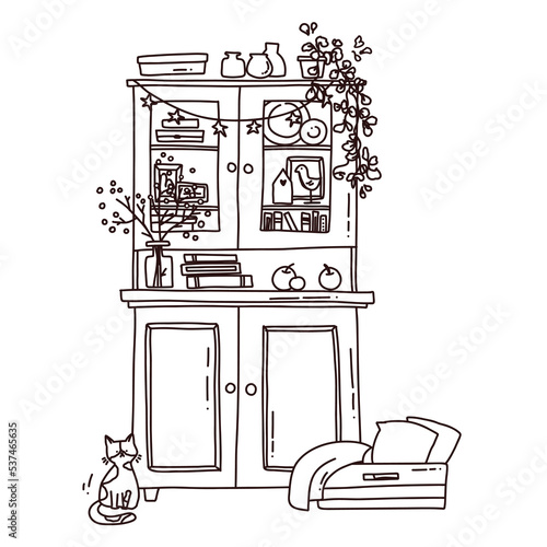 sideboard with books and a cat outline