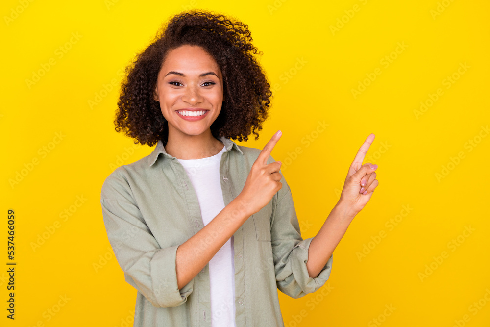 Photo of lady worker promoter point hands empty space adverts isolated on bright vibrant color background Photo of lady worker promoter point hands empty space adverts isolated on bright vibrant color background