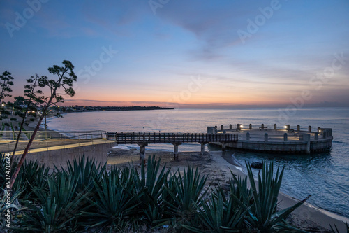 the roundabout overlooking the sea and the beach of Avola with the splendid colors of sunrise