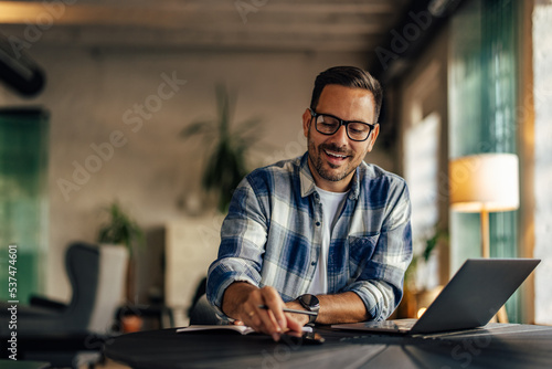 Businessman working at the office, making some plans, writing th