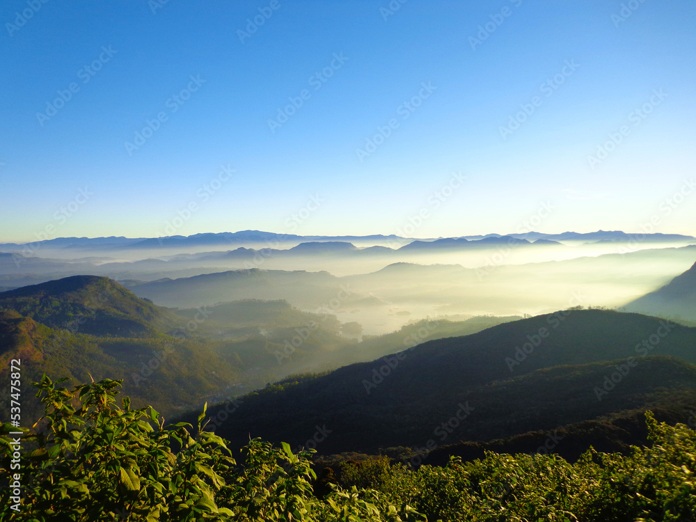 Beautiful Landscape of mountain layer in morning sun ray and winter fog at Sri Pada or Adam's Peak, Sri Lanka.