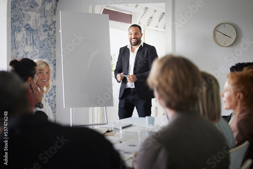 Man having presentation at business meeting photo