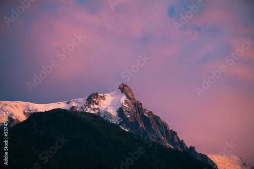 Snowcapped peak against purple sky photo
