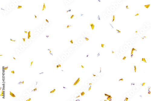 Golden silver sparkling confetti isolated on blue. Holiday effect