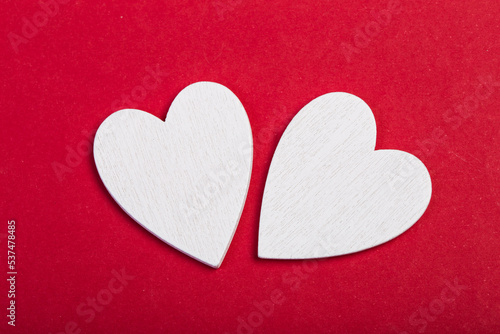 two white hearts on red background