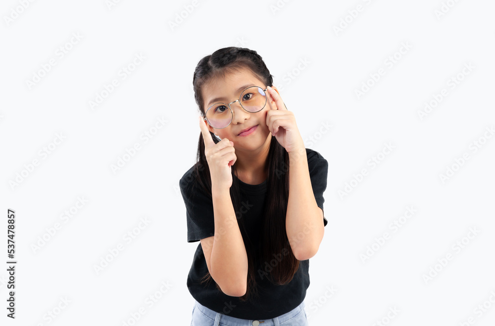 Asian cute kid in black t-shirt wearing eyeglasses posing on white background. Asian cute kid in black t-shirt wearing eyeglasses posing on white background.
