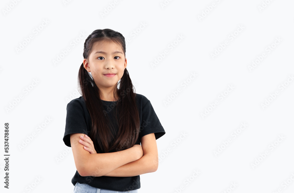 Little asian girl student in casual posing arm cross body on white background. Little asian girl student in casual posing arm cross body on white background.