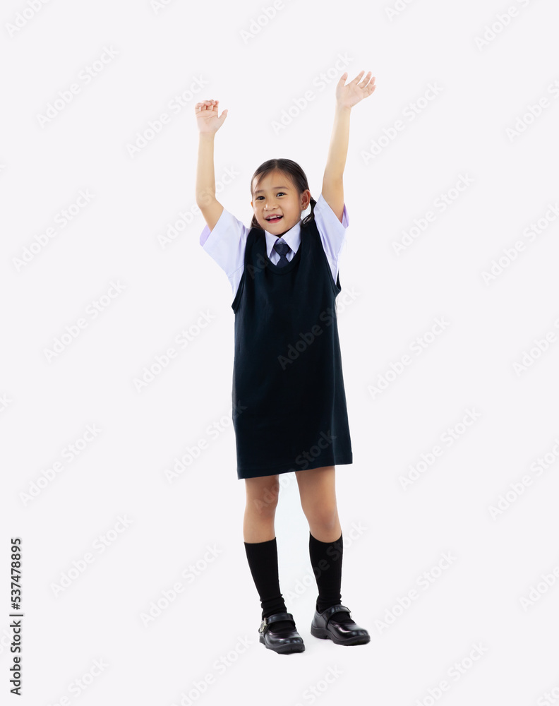 Back to school, junior schoolgirl in student uniform posing happy and hands up on white background. Back to school, junior schoolgirl in student uniform posing happy and hands up on white background.