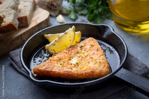 Obraz na płótnie Saganaki is a Greek delicacy of fried cheese. w salonie