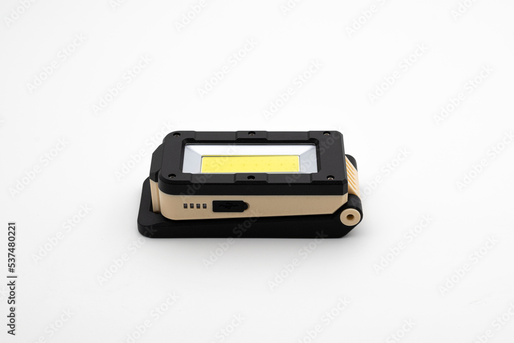 Modern Portable Load Shedding Folding LED Work Light With Torch Battery Powered USB Rechargeable Magnetic Base Adjustable Angle Durable Industrial Isolated in White Background Modern Portable Load Shedding Folding LED Work Light With Torch Battery Powered USB Rechargeable Magnetic Base Adjustable Angle Durable Industrial Isolated in White Background