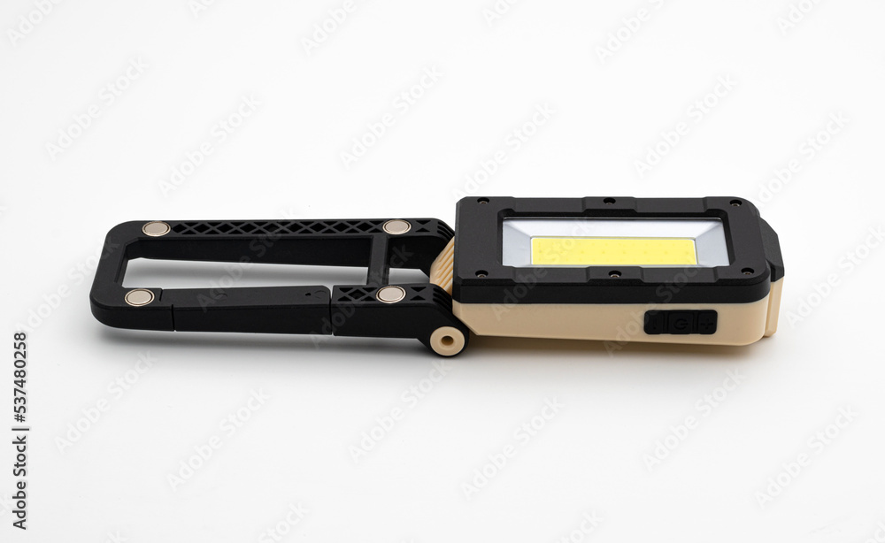 Modern Portable Load Shedding Folding LED Work Light With Torch Battery Powered USB Rechargeable Magnetic Base Adjustable Angle Durable Industrial Isolated in White Background