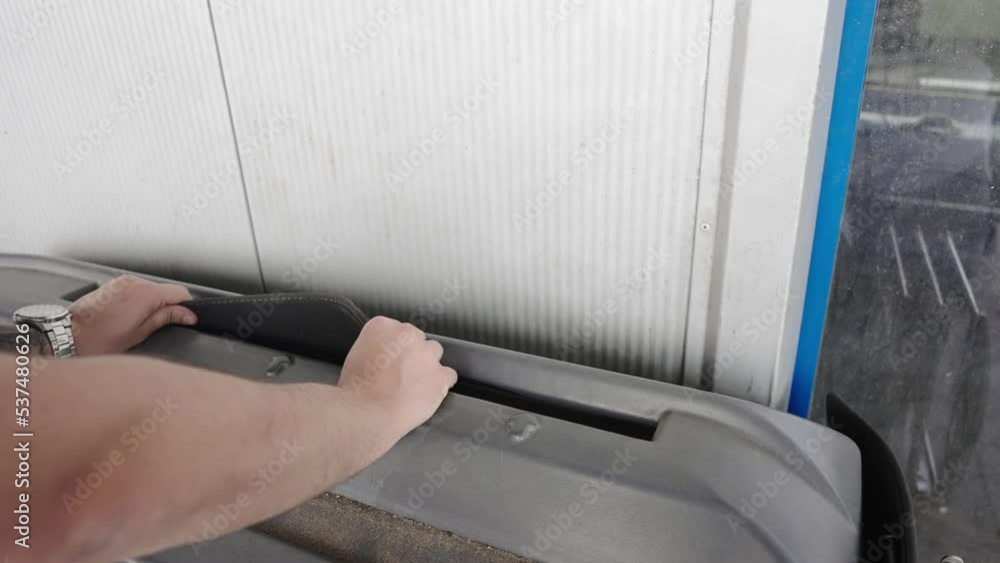 Clean car carpet floor mats on self service automatic machine in car wash Clean car carpet floor mats on self service automatic machine in car wash