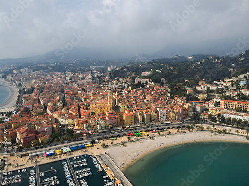 Aerial view of Menton in French Riviera from above. Drone view of France Cote d'Azur sand beach beneath the colorful old town of Menton. Small color houses near the border with Italy, Europe. © AerialDronePics