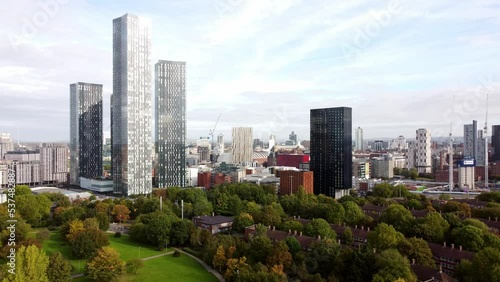 Manchester city skyline aerial panning view across modern high rise skyscraper apartment offices photo