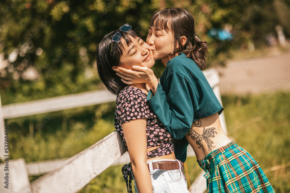 Fototapeta premium Sweet girls looking happy and ejoyed while spending time together