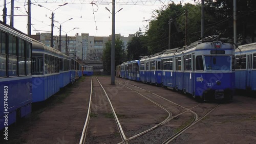 A Group Of Empty Trams Standing In A City Depot In Ukraine, No People photo