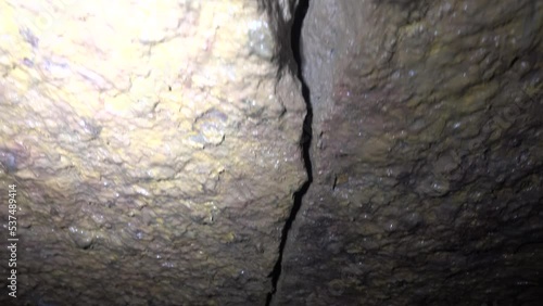 Hiking of spelunkers in the old limestone galleries (adit), underground inhabitants
