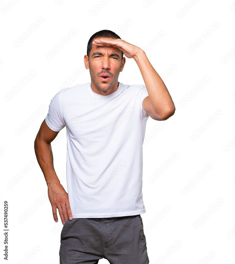 Concentrated young man with a gesture of looking away Concentrated young man with a gesture of looking away
